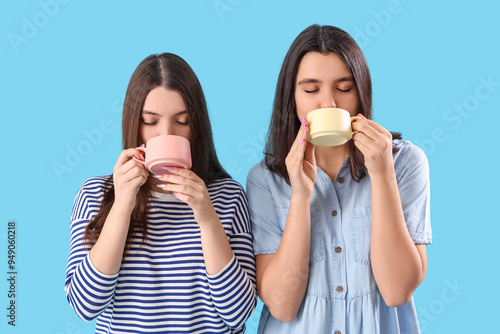 Young woman with cup of tea...