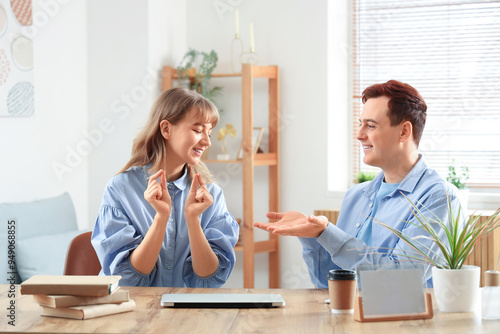 Young deaf mute couple usin...