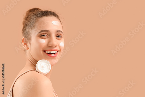 Young woman with jar of fac...
