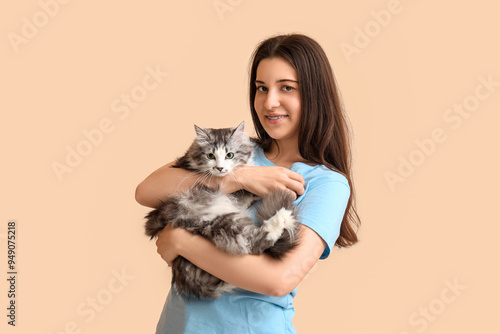 Young woman holding cute lo...