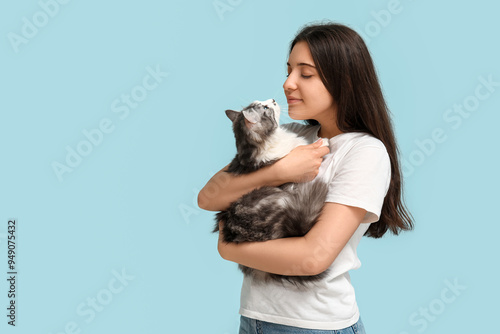 Young woman holding cute lo...