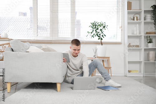 Young male freelancer with ...