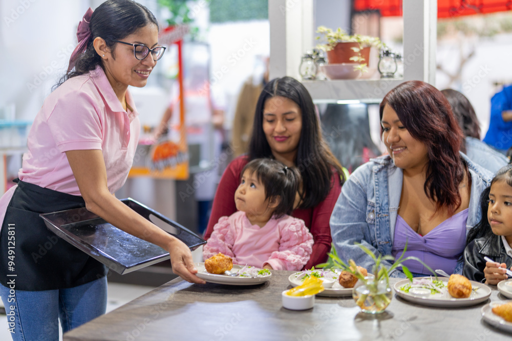 Latin american waitress serving traditional peruvian food to customers Latin american waitress serving traditional peruvian food to customers