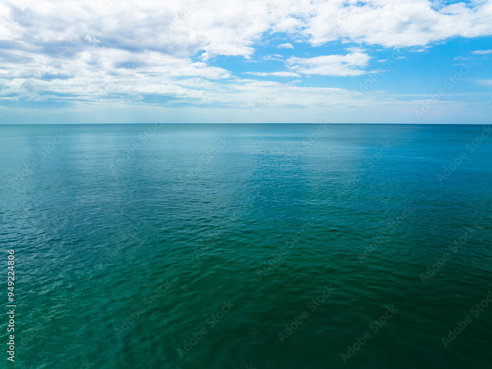 Obraz premium Sea surface aerial view,Bird eye view photo of blue waves and water surface texture Blue sea background Beautiful nature Amazing view sea background