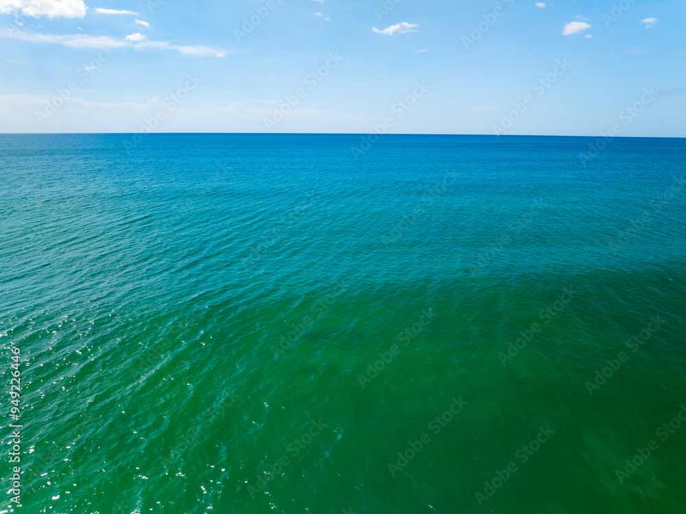Fototapeta premium Sea surface aerial view,Bird eye view photo of blue waves and water surface texture Blue sea background Beautiful nature Amazing view sea background