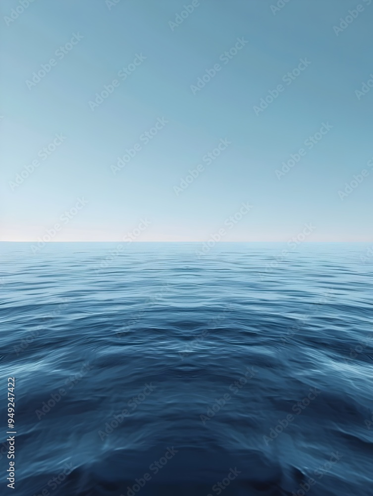 A vast expanse of blue ocean stretches out to the horizon under a clear sky. A vast expanse of blue ocean stretches out to the horizon under a clear sky.