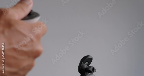 Close-up male hands, using VR gunstock controllers with magnets for video game. photo