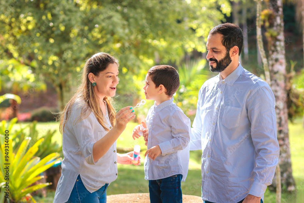 A happy family enjoys a sunny day outdoors, blowing bubbles and creating fun memories. A joyful, carefree moment that captures love, connection, and togetherness in nature. A happy family enjoys a sunny day outdoors, blowing bubbles and creating fun memories. A joyful, carefree moment that captures love, connection, and togetherness in nature.