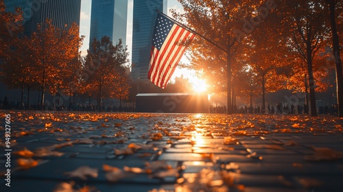 Ground Zero Memorial with the American flag under the warm light of the September sunset