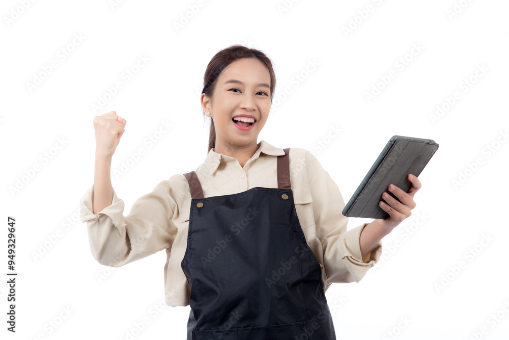 Portrait young asian barista woman wearing an apron celebrating success while using a tablet isolated white background, woman expression with satisfied and happy about small business with success.