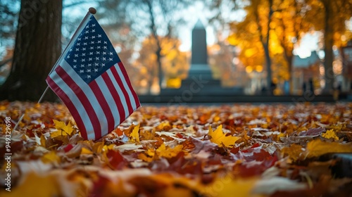 Ground Zero Memorial with the American flag standing out against the backdrop of autumn leaves