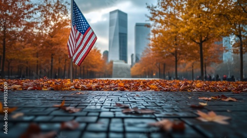 Ground Zero Memorial with an American flag and autumn leaves in the background