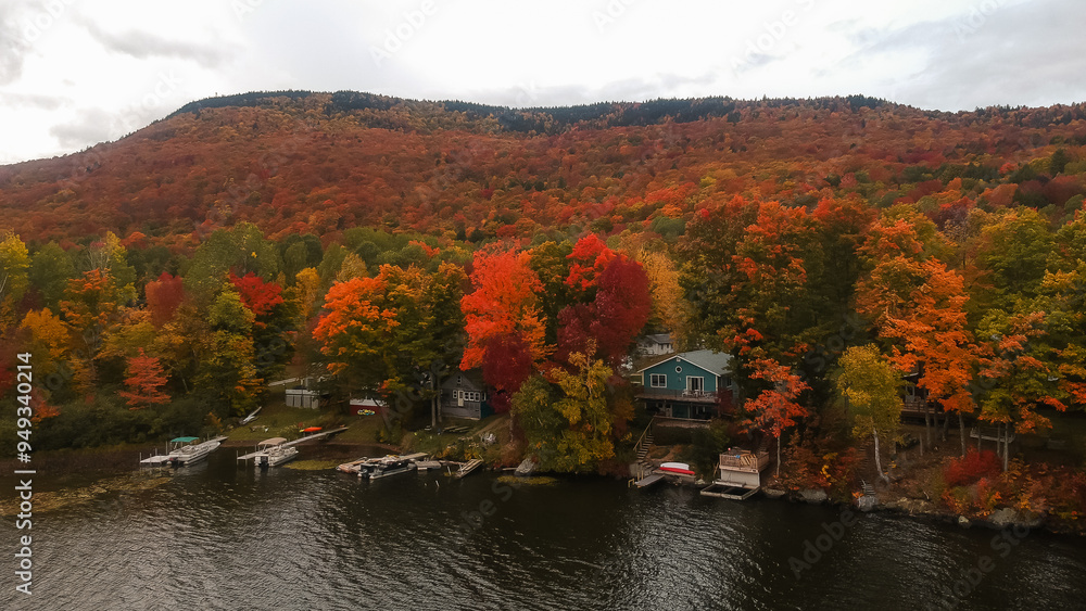 Obraz premium Row of Lake Houses Aerial Drone Shot Vermont Lake Autumn Fall Foliage Lake House Colorful Trees Beautiful Nature Landscape Vacation Travel New England