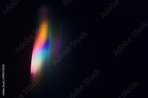 Abstract background with a rainbow spectrum flare on a textured wall, window's reflection