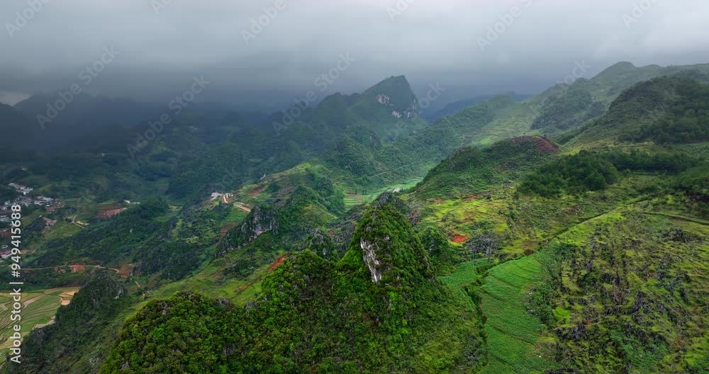 Typical landscape of North Vietnam near Dong Van, Asia. Aerial drone orbiting on cloudy day Typical landscape of North Vietnam near Dong Van, Asia. Aerial drone orbiting on cloudy day