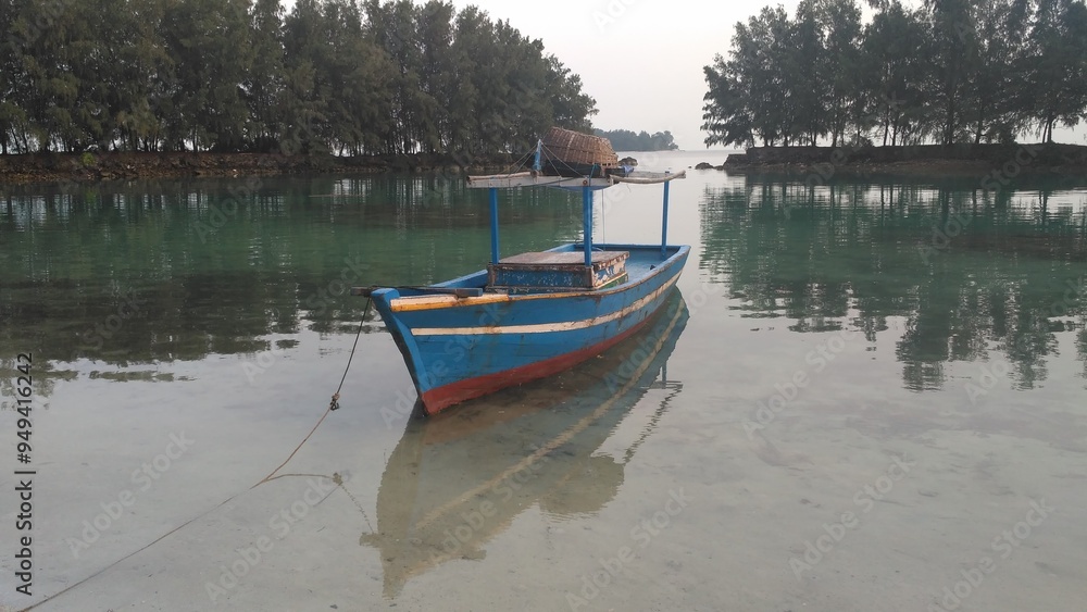 Tranquil Morning with a Wooden Fishing Boat on Clear Waters Tranquil Morning with a Wooden Fishing Boat on Clear Waters