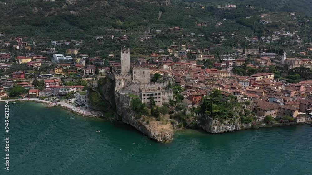 Aerial view of the medieval castle in the town of Malcesine on Lake Garda, Italy on a sunny summer day Aerial view of the medieval castle in the town of Malcesine on Lake Garda, Italy on a sunny summer day