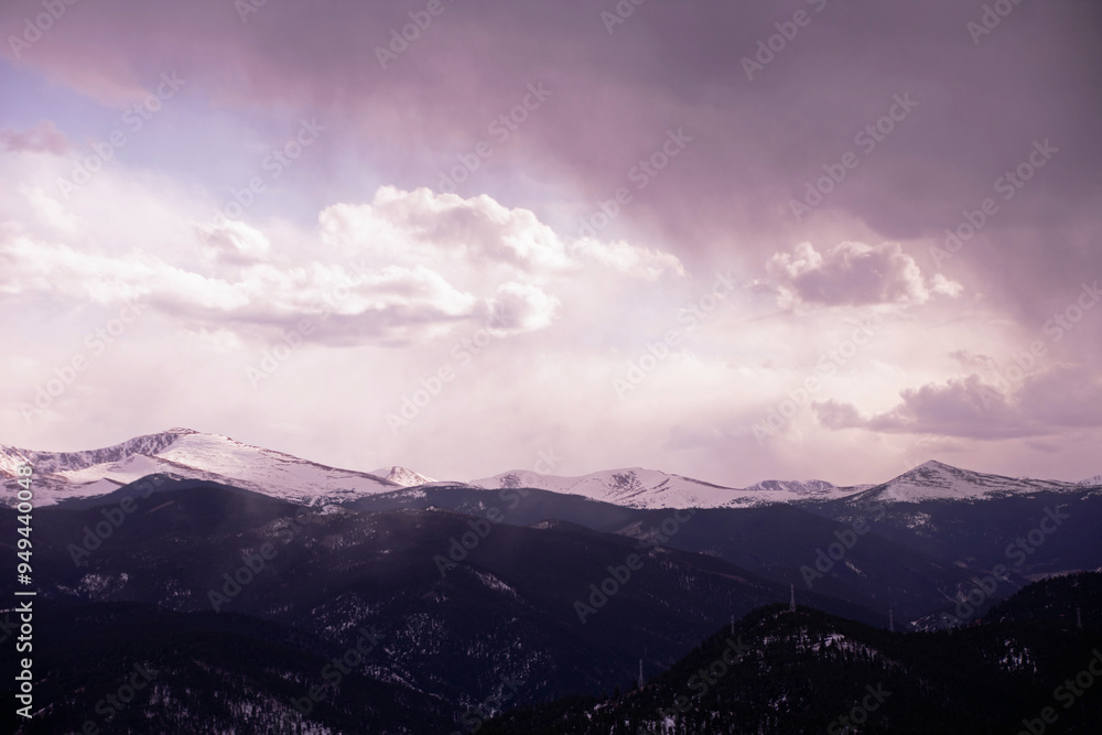 snowstorm coming in over the distant mountains snowstorm coming in over the distant mountains