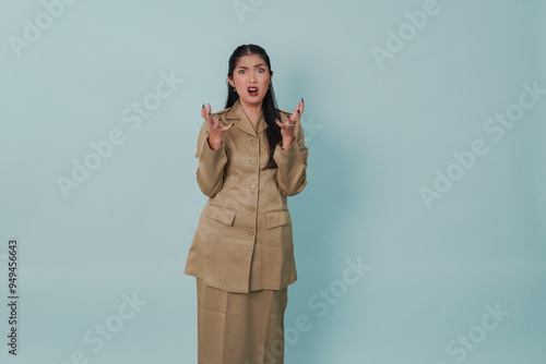 Frustrated Indonesian government worker woman wearing khaki uniform feeling angry. photo