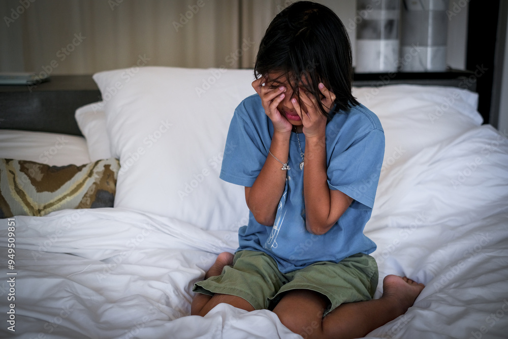 Crying girl, victim of bullying, abuse, violence, depressed patient, offering psychotherapy sitting on the bed. She was bullied, unhappy, upset, feel sick. Lonely concept. Crying girl, victim of bullying, abuse, violence, depressed patient, offering psychotherapy sitting on the bed. She was bullied, unhappy, upset, feel sick. Lonely concept.