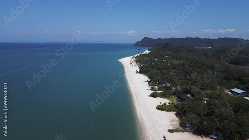 Wallpaper Mural Tropical island beach with villa resorts and rainforest meeting turquoise ocean water. Fantastic aerial view flight descending drone Torontodigital.ca