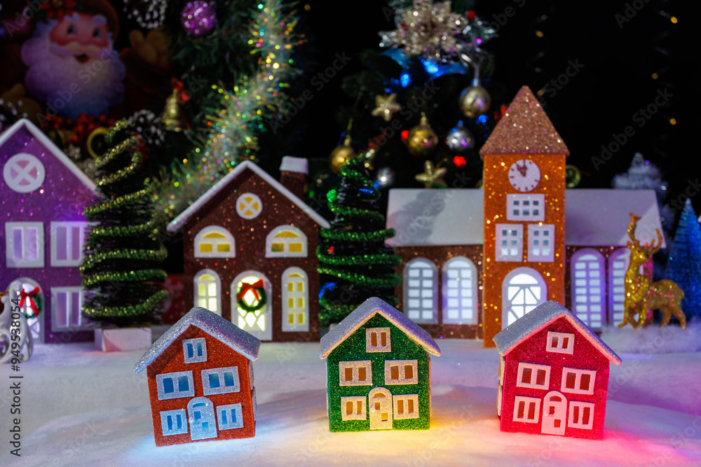 A town of small Christmas houses against the backdrop of Christmas trees and medium-sized Christmas houses A town of small Christmas houses against the backdrop of Christmas trees and medium-sized Christmas houses