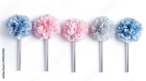 Colorful pom-pom pens arranged in a row on a white background.