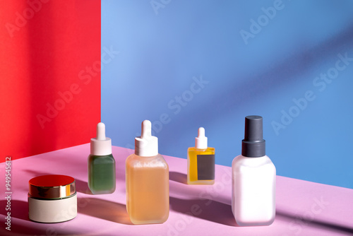 Group of beauty products in a studio shot  with colorful fashion setup