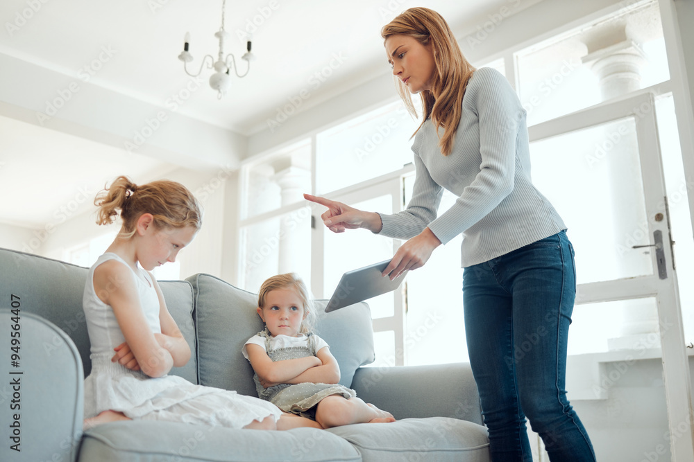 Tablet, online safety and mother scolding girl child on sofa in living room of home for development. Discipline, social media and technology with parent teaching lesson to daughter in apartment Tablet, online safety and mother scolding girl child on sofa in living room of home for development. Discipline, social media and technology with parent teaching lesson to daughter in apartment