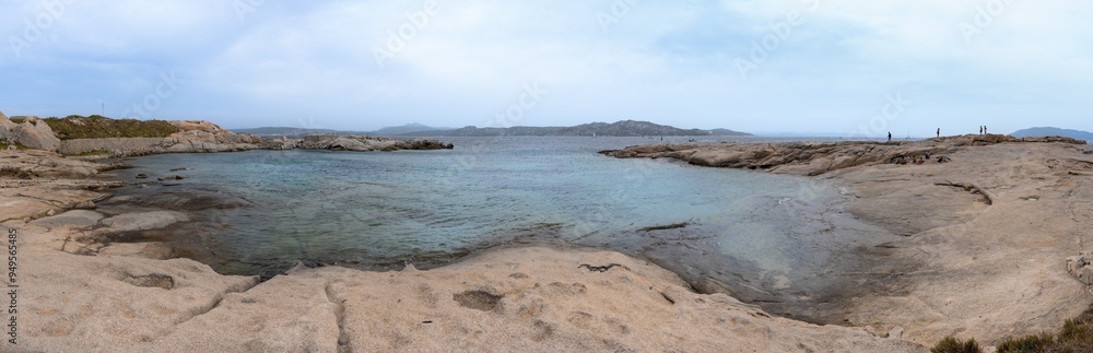 Punta Tegge Beach. Panoramic view of the granite beach sinking into the water of Punta Tegge on the island of La Maddalena, Italy, without people Punta Tegge Beach. Panoramic view of the granite beach sinking into the water of Punta Tegge on the island of La Maddalena, Italy, without people