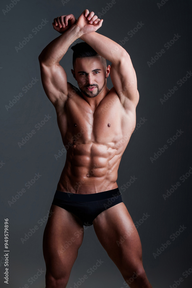 Fototapeta premium Topless man with muscle. Sexy male body. Handsome sexy model. Shirtless muscled male model. Man with a naked torso. Muscular young man with perfect body stripping. Sexy man. Seductive guy.