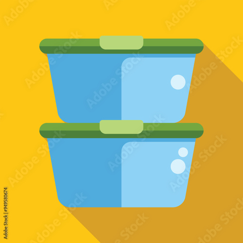 Two blue plastic lunch boxes are stacked on a yellow background with their green lids closed