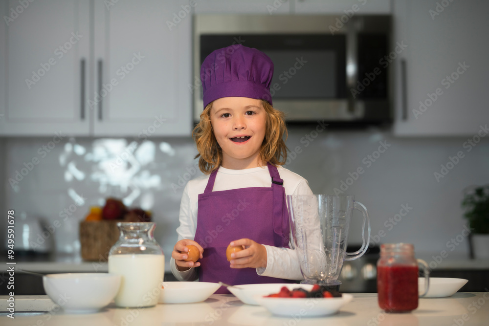 Child chef preparing healthy meal. Cute kid boy in chef uniform on kitchen. Child chef preparing healthy meal. Cute kid boy in chef uniform on kitchen.