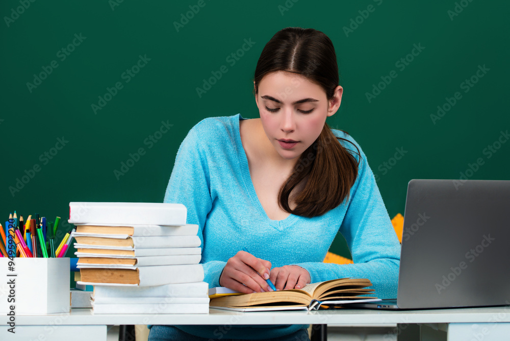 Student girl in classroom. School teenager girl in middle school. Schoolgirl in high school. College student learning in college classroom. Education concept. Lesson and homework in university. Student girl in classroom. School teenager girl in middle school. Schoolgirl in high school. College student learning in college classroom. Education concept. Lesson and homework in university.
