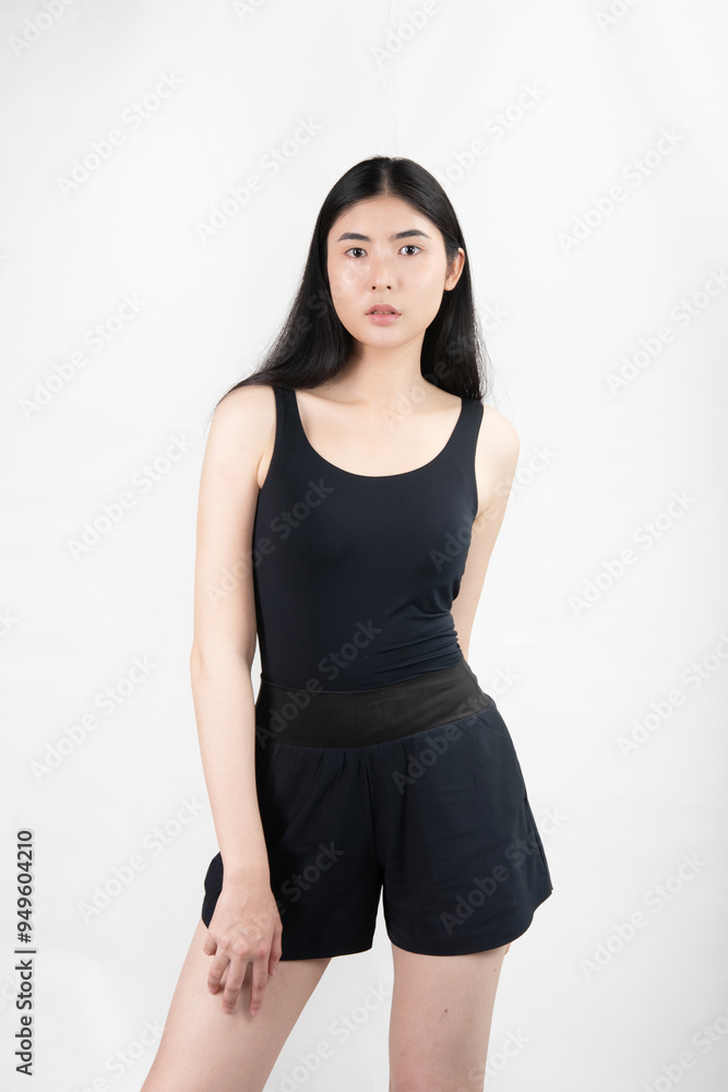 Portrait of confident young Asian woman wearing a black tank top no isolated white background
Portrait of confident young Asian woman wearing a black tank top no isolated white background