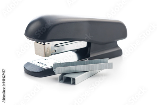 Black office stapler isolated on white background.