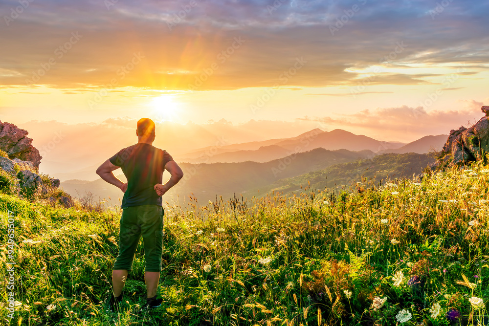 happy man watching amazing highland evening sunset, person delight with nature landscape happy man watching amazing highland evening sunset, person delight with nature landscape