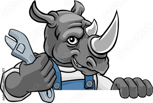 A rhino cartoon animal mascot plumber, mechanic or handyman builder construction maintenance contractor peeking around a sign holding a spanner or wrench