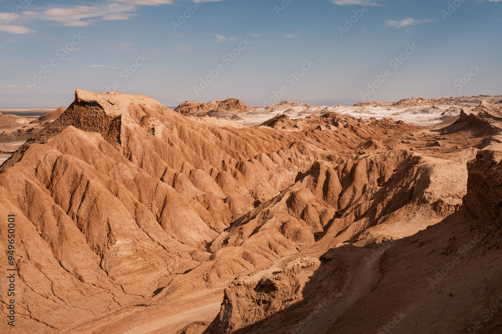 Rolling, rugged terrain of Cordillera del Sal showcases its unique ochre formations under a clear blue sky, San Pedro de Atacama, Chile. Rolling, rugged terrain of Cordillera del Sal showcases its unique ochre formations under a clear blue sky, San Pedro de Atacama, Chile.