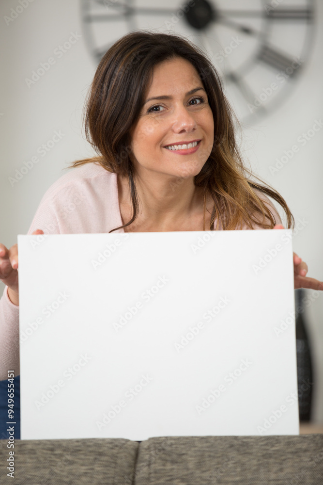 happy woman looking at camera pointing at banner happy woman looking at camera pointing at banner