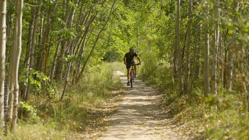 Cyclist rides bicycle on dedicated cycling path Cyclist rides bicycle on dedicated cycling path