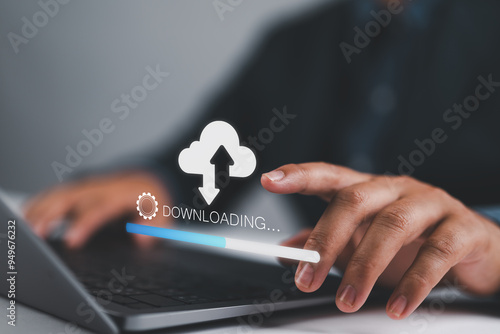 Download processing data concept. Person use laptop with virtual screen of downloading bar for download files. Downloading data from cloud storage. photo