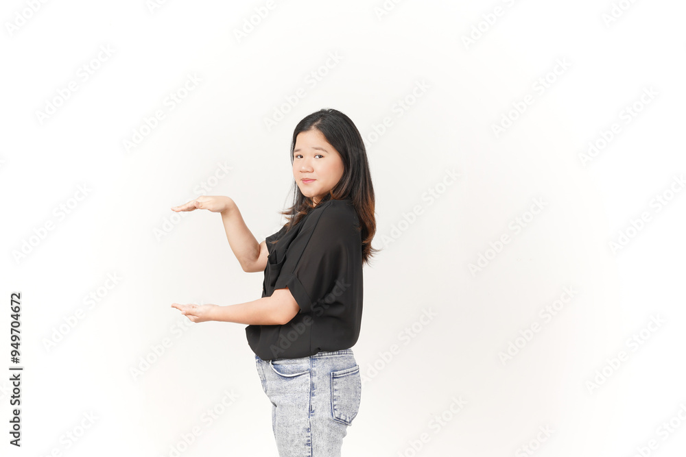Young Asian woman Measuring and Showing Big Product wearing Black t-shirt and jeans isolated on white background Young Asian woman Measuring and Showing Big Product wearing Black t-shirt and jeans isolated on white background