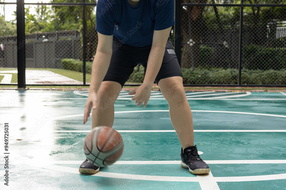 Man Stretching on Basketball Court Outdoors Man Stretching on Basketball Court Outdoors