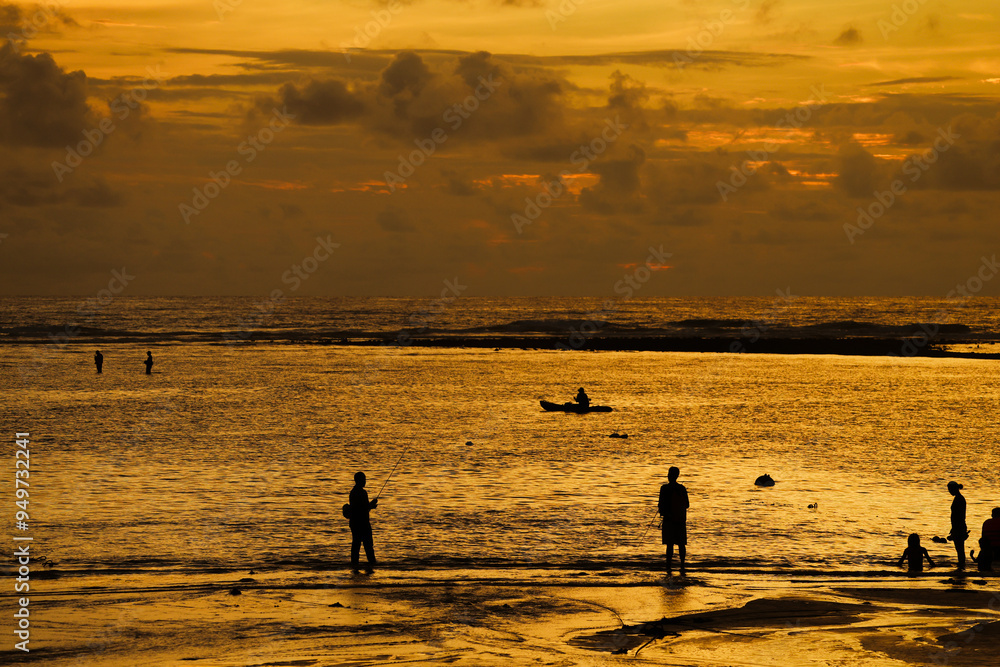 The sun and silhouette people on the beach at golden hour time background The sun and silhouette people on the beach at golden hour time background