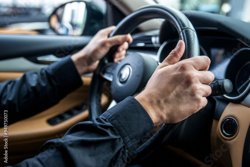 Driver's hands on steering wheel. Close-up of a driver's hands gripping the steering wheel, conveying control and focus.