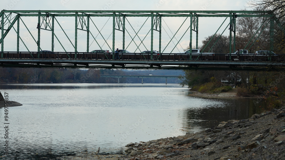 Naklejka premium One old rion frames bridge view on the river with the sunset sky as background