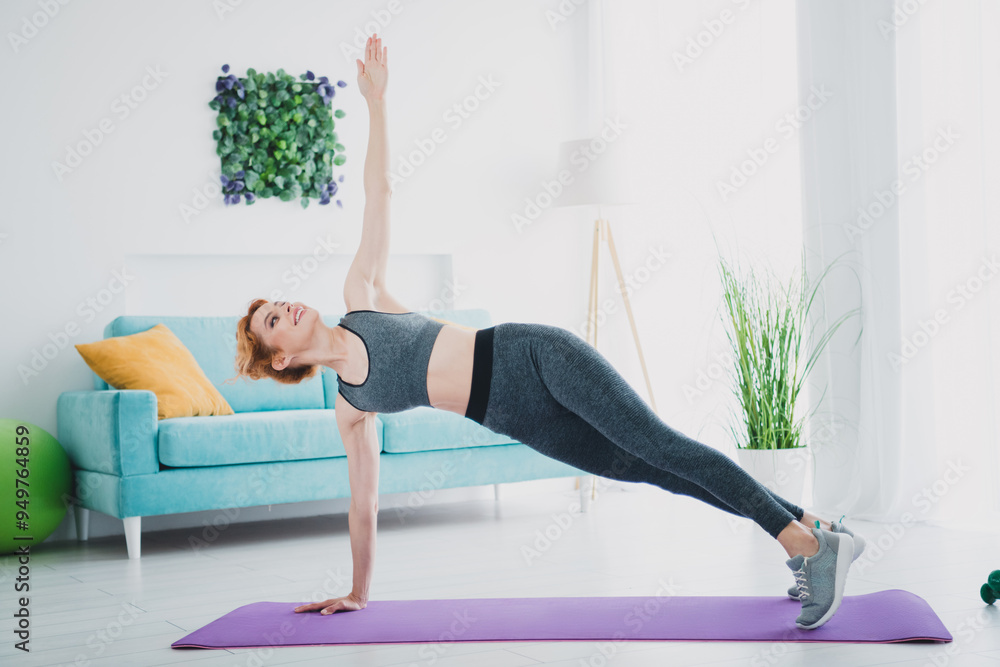 Full body portrait of pretty sportive young woman stretch fitness mat home gym workout indoors Full body portrait of pretty sportive young woman stretch fitness mat home gym workout indoors