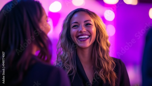 portrait of business women in professional attire, smiling and laughing together at an event 