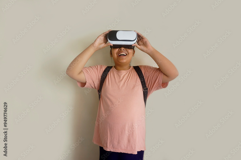 Cute Asian Fat Little Girl Student Wearing VR Glasses Interacting For the First Time, Studio Shot Cute Asian Fat Little Girl Student Wearing VR Glasses Interacting For the First Time, Studio Shot
